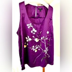 Satin finish purple tunic top with painted look flowers. Size XL.